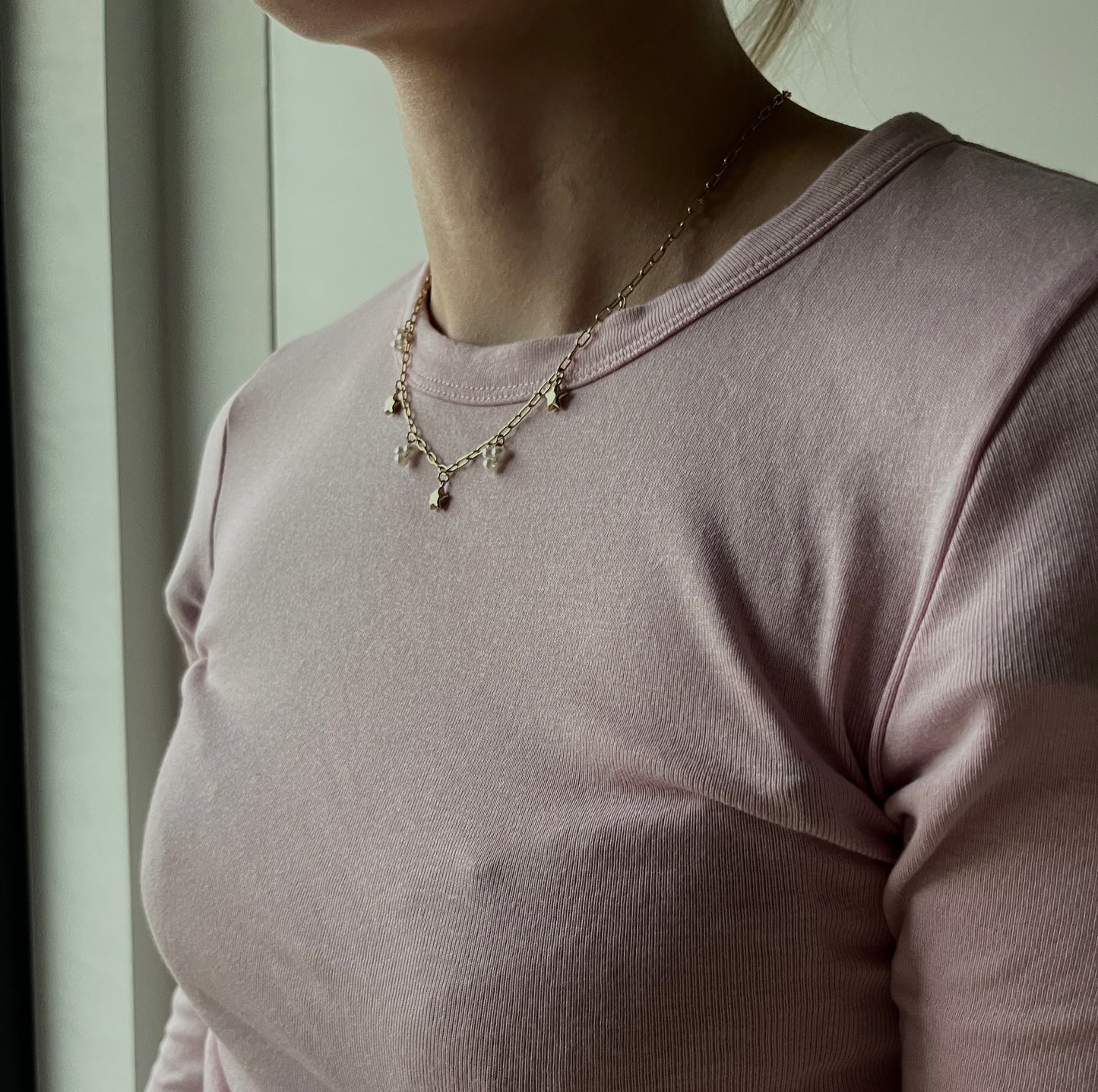 SCHAKELKETTING MET BEDELS GOUD