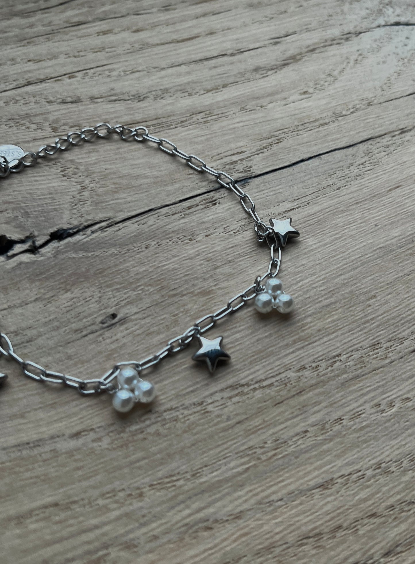 SCHAKELARMBAND MET BEDELS ZILVER