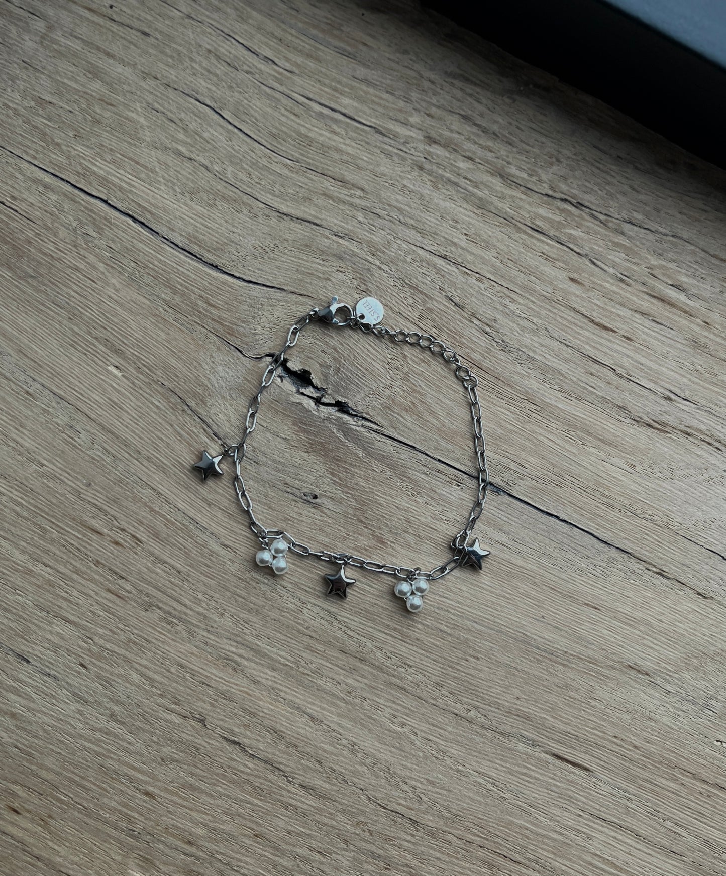 SCHAKELARMBAND MET BEDELS ZILVER