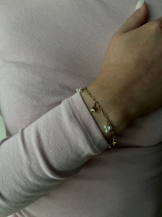 SCHAKELARMBAND MET BEDELS GOUD