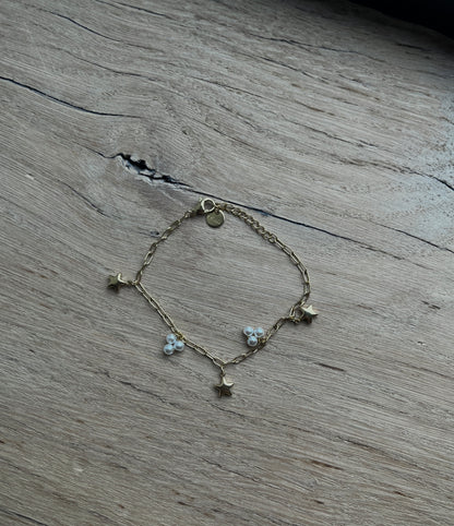 SCHAKELARMBAND MET BEDELS GOUD